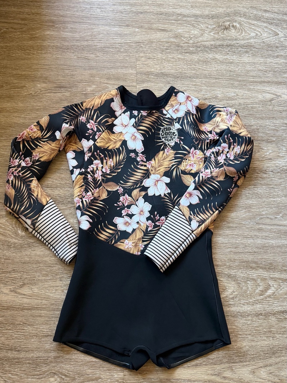 Rip Curl Women's Black Floral Long Sleeve Springsuit with Gold Accents